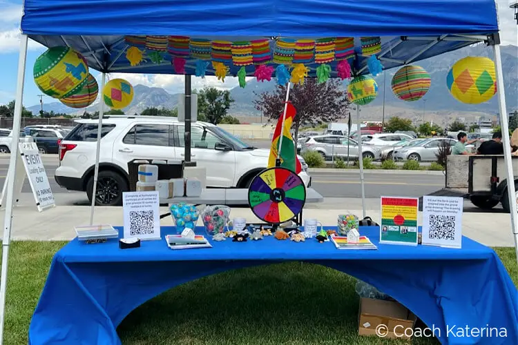 A photo of Katerina Gasset's booth at the Annual Bolivian Festival in Orem Utah, promoting their real estate company