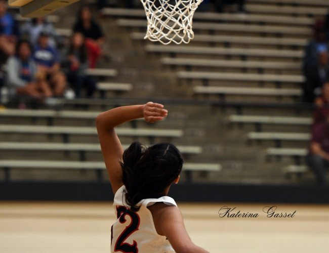 Intense women's basketball game between BYU and Boise State at BYU in Provo, Utah, with players in action on the court.