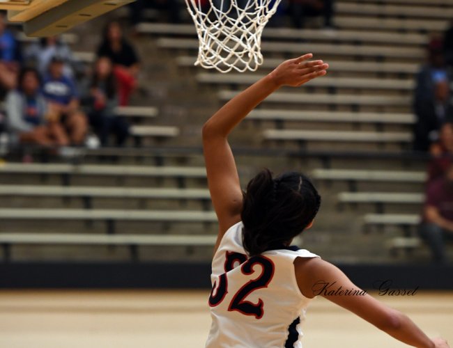 Intense women's basketball game between BYU and Idaho State at BYU in Provo, Utah, with players in action on the court.