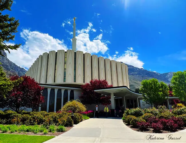 Church of Jesus Christ of the Latter Day Saints temple located in Provo Utah with mountains in the background. Photo taken by Katerina Gasset owner of the Move to Provo website