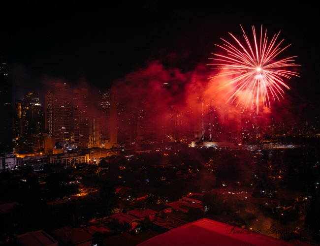 Lunar New Year Celebration in Orem, Utah, with vibrant fireworks lighting up the night sky, traditional decorations, and a festive crowd celebrating.