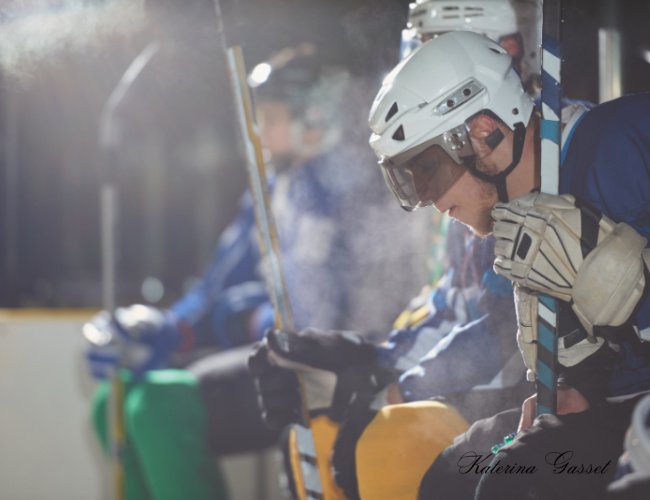 Provo Predators hockey team facing off against the Utah Outliers in Provo, Utah, featuring intense on-ice action, players in team jerseys, and an energetic crowd.