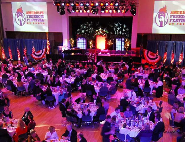 Elegant Freedom Awards Gala in Provo, Utah, with attendees in formal attire, awards presentations, and a sophisticated, celebratory atmosphere.